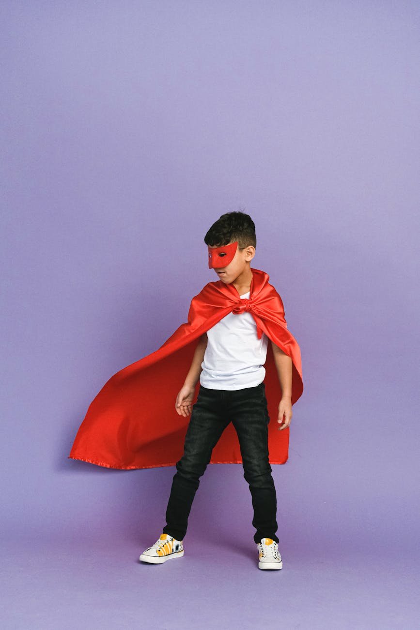 a boy wearing a superhero costume